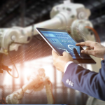 tablet in front of machinery