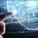 finger pointing at digital globe